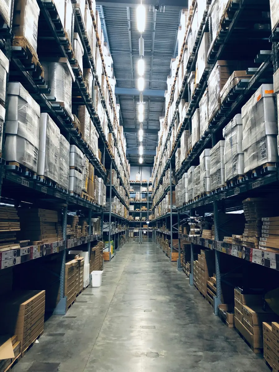 Aisles of shelving stacked with boxes in a bonded warehouse